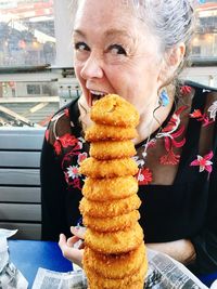 Close-up portrait of happy boy eating food