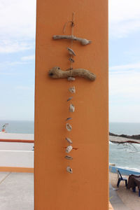 Close-up of metal chain on beach