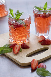 Glass of fruit on table