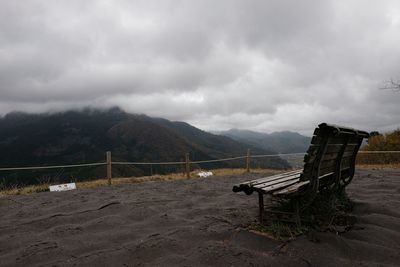 Scenic view of mountains against cloudy sky