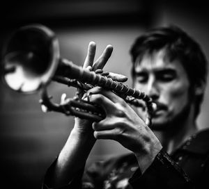 Close-up of man playing musical instrument