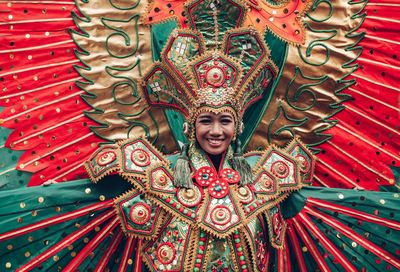 Portrait of smiling mid adult woman wearing costume during traditional festival