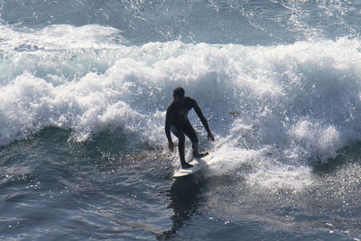 Rear view of man in sea