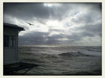 Scenic view of sea against cloudy sky