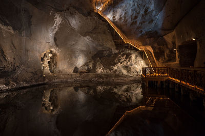 Pond in illuminated cave