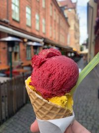 Hand holding ice cream cone