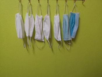 Clothes drying on clothesline against wall