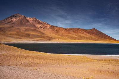 Scenic view of salt flats against sky