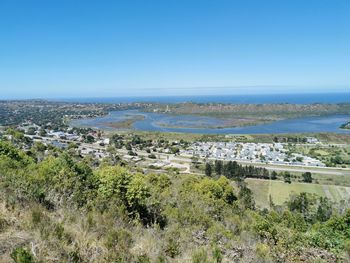 Scenic view of sea against clear blue sky