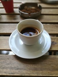 Close-up of coffee cup on table