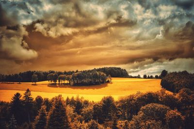 Scenic view of landscape against cloudy sky