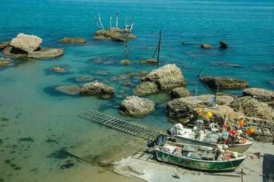 High angle view of boats moored at sea shore