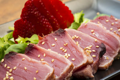 Close-up of tuna tataki garnished with sesame seeds