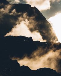 Low angle view of silhouette mountain against sky