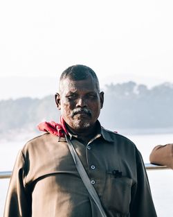 Portrait of man wearing sunglasses against sky