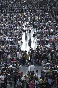 Crowd waiting at railroad station