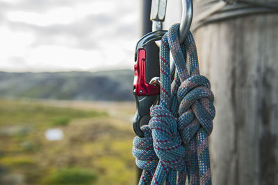 Close up of carabiner and rope at high rope obstacle course