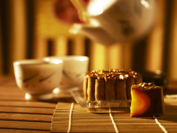 Close-up of sweet food with tea on table