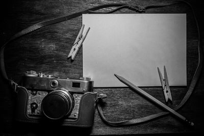 High angle view of old camera on table