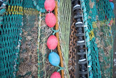 Directly above shot of buoy and fishing nets on field