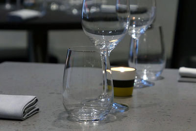 Close-up of drinking glasses on table at restaurant