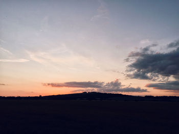 Scenic view of silhouette landscape against sky during sunset