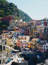 High angle view of townscape by sea against sky