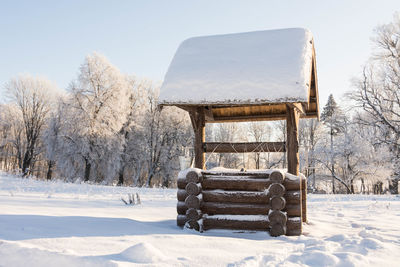 House on snow covered landscape