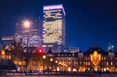 Illuminated buildings in city at night