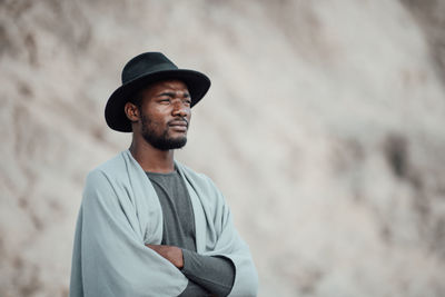 Portrait of young man looking away