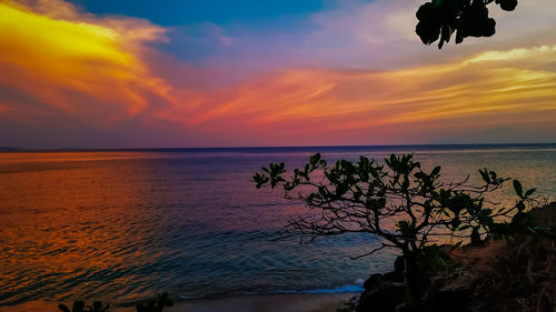 Scenic view of sea against cloudy sky