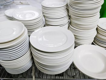 Stack of plates on table in kitchen