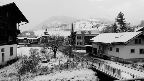 Snow covered houses in town