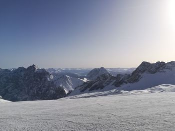 Scenic view of snowcapped mountains against clear sky