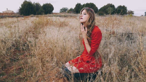 Young woman on grassy field