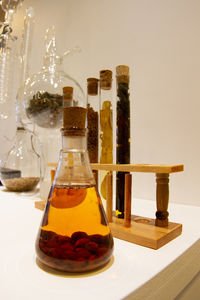 Close-up of drink served on table against white background