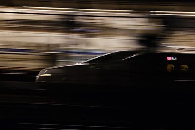 Blurred motion of car on city street at night