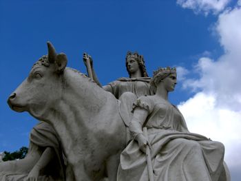 Low angle view of statue against sky