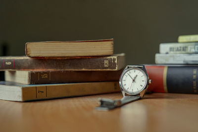 Close-up of clock on table