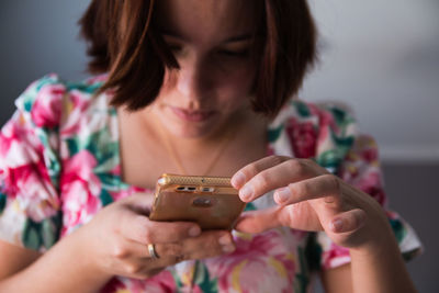 Close-up portrait of woman holding hands