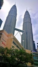 Low angle view of modern buildings against sky