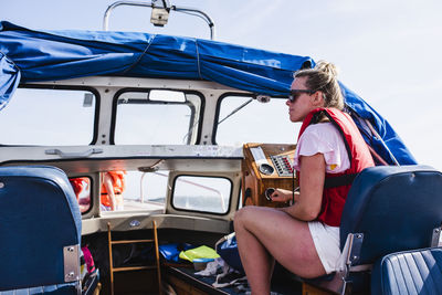 Woman sitting on boat