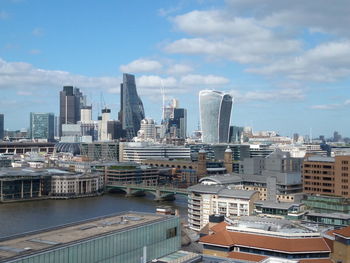 Modern buildings in city against sky