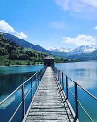 Bridge over lake against sky