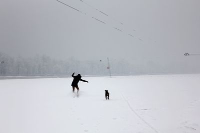Two men on snow covered landscape