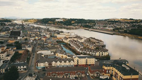 High angle view of river amidst buildings in city