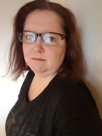 Close-up portrait of smiling young woman