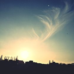 Silhouette of building at sunset