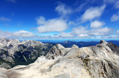 Panoramic view of mountains against blue sky