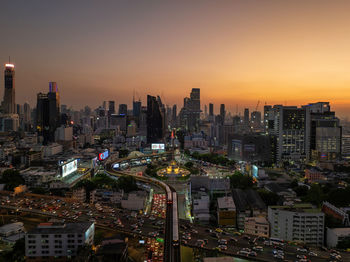 High angle view of city at sunset